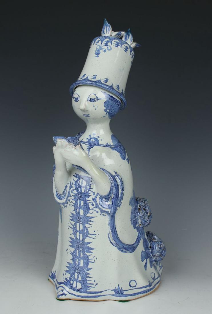 Bjorn Wiinblad figurine M13 "Aunt Ella Reading": MANUFACTURE: Nymolle (DENMARK) DESIGNED: Bjorn Wiinblad (1918-2006) NAME: Aunt Ella Reading SERIES: Aunt Ella YEAR: 1973 NUMBER: M13 CONDITION: Excellent. No chips, no cracks. NO BOX HEIGHT: 10 1/2 in