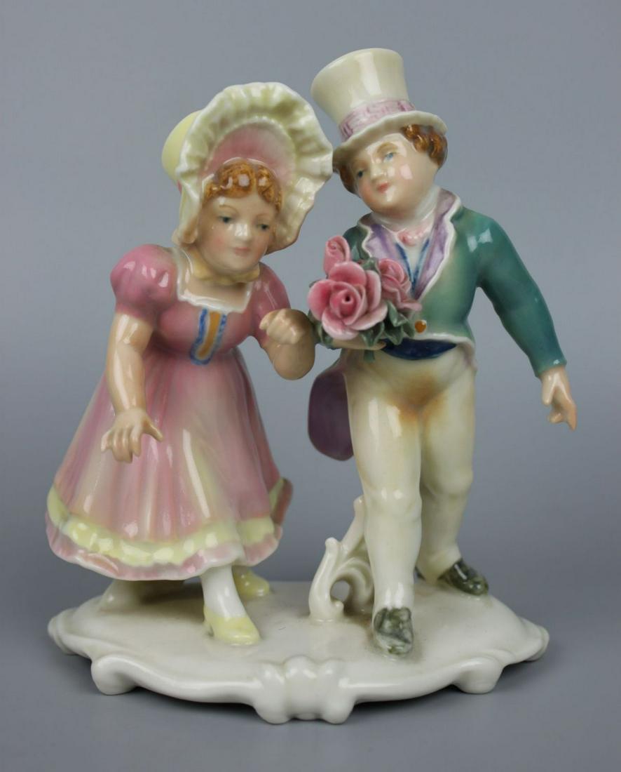 Dresden Volkstedt Karl Ens figurine Courting Children: MANUFACTURE: Dresden Volkstedt Karl Ens (GERMANY) NAME: Courting Children CONDITION: Excellent. No chips, no cracks. NO BOX. HEIGHT: 5 1/2 inch / 14 cm WIDTH: 5 inch / 12 cm DEEP: 3 inch / 7 cm CATEGO