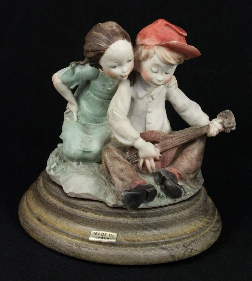 Giuseppe Armani Figurine Girl and Boy with Lute: MANUFACTURE: Florence - Giuseppe Armani (Italy) NAME: Girl and Boy with Lute NUMBER: - ISSUED: circa 1980 CONDITION: MINT. NO BOX. HEIGHT: 4 inch / 10 cm WIDTH: 4 inch / 10 cm DEEP: 4 inch / 10 cm MAR