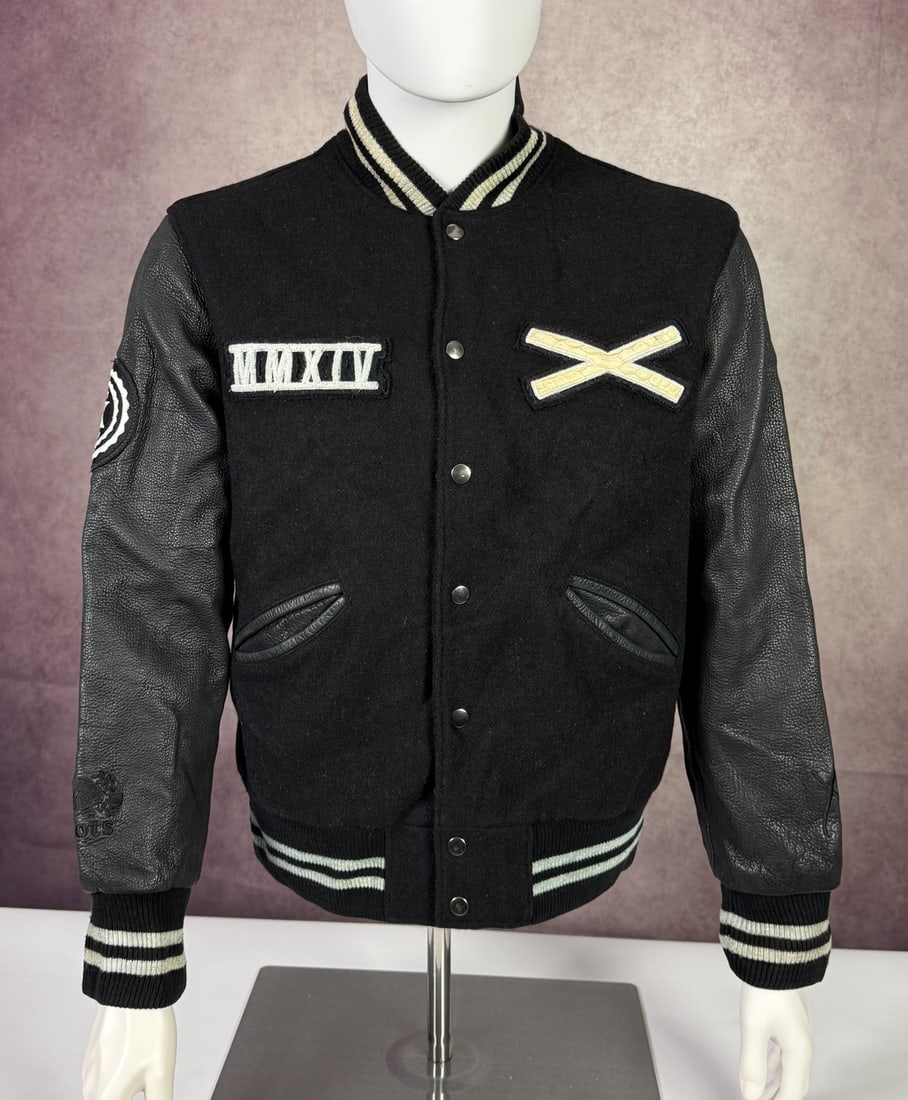 The Weeknd's Wardrobe - Renzo Cardoni x XO varsity jacket: Renzo Cardoni The Weeknd x XO x Roots Varsity Jacket Made in Canada. Renzo Cardoni is the Toronto-based leather atelier behind several XO bespoke commissions. CONDITION: Pre-owned. The photographs are