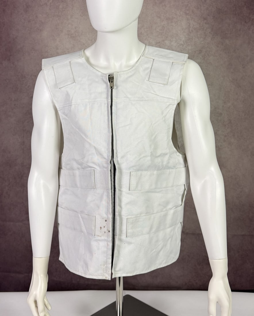 The Weeknd's Wardrobe - XO vest: The Weeknd XO white Vest with Python Skin Logo The Weeknd Exclusive. XO is The Weeknd's own label and lifestyle imprint, released through Republic Records. CONDITION: Pre-owned. The photographs are pa