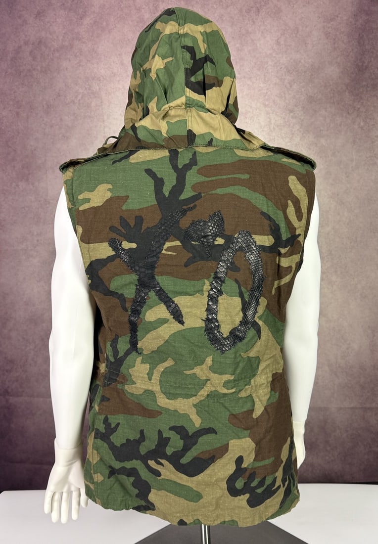 The Weeknd's Wardrobe - XO vest: The Weeknd XO Mens Military Vest with Python Skin Logo. XO is The Weeknd's own label and lifestyle imprint, released through Republic Records. CONDITION: Pre-owned. The photographs are part of this de