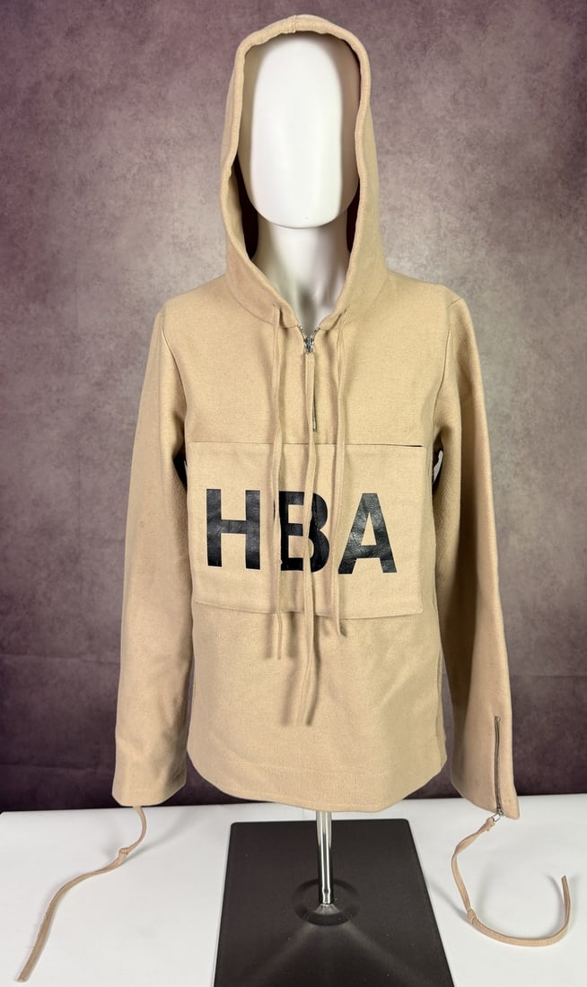 The Weeknd's Wardrobe - Hood By Air hoodie: Hood By Air Archive HBA camel boiled wool hoodie logo patch. Hood By Air is the New York avant-garde label founded by Shayne Oliver in 2006. SIZE: M CONDITION: Pre-owned. The photographs are part of t