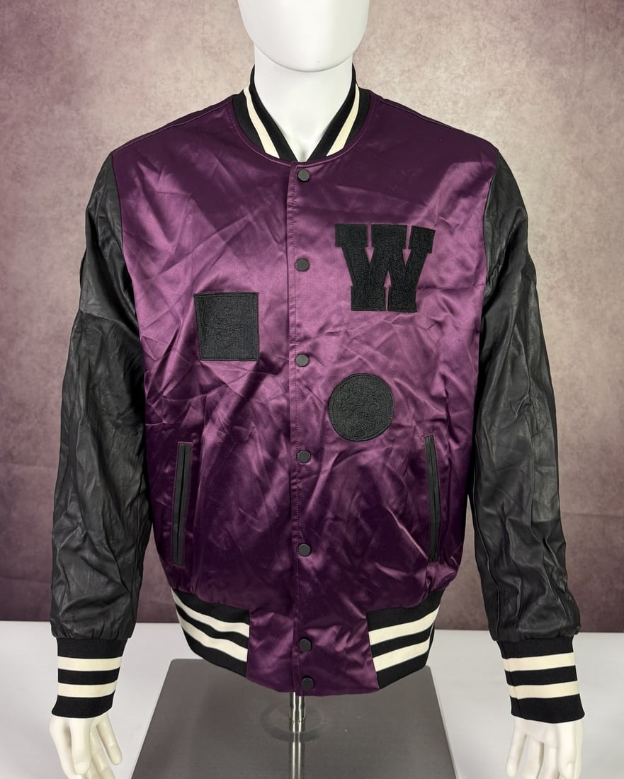 The Weeknd's Wardrobe - XO bomber jacket: The Weeknd XO x H&M Big Logo Satin Bomber Jacket. XO is The Weeknd's own label and lifestyle imprint, released through Republic Records. SIZE: L CONDITION: Pre-owned. The photographs are part of this 
