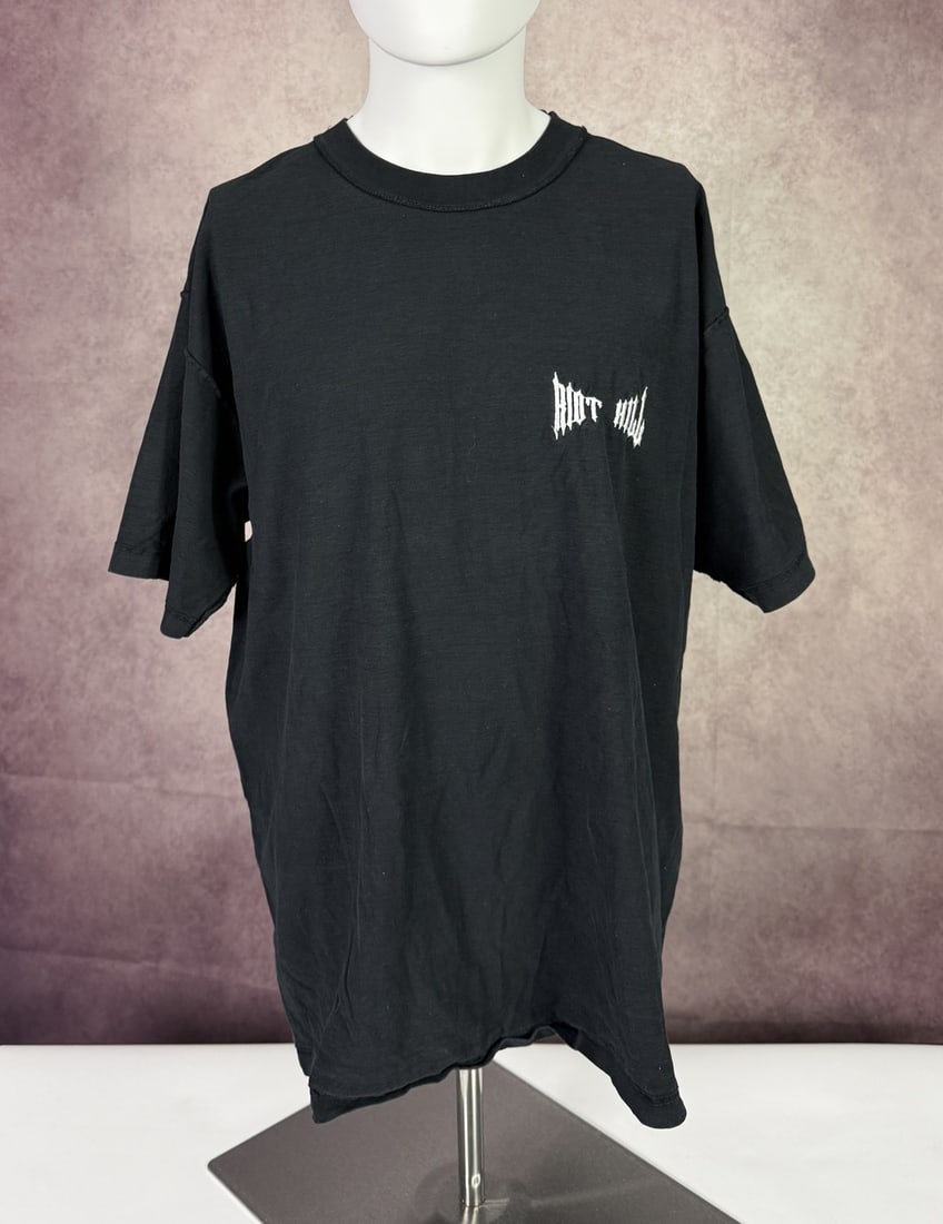 The Weeknd's Wardrobe - Riot Hill t-shirt: Riot Hill T-Shirt. SIZE: XL CONDITION: Pre-owned. The photographs are part of this description - please review them carefully to assess condition. PROVENANCE: From the personal collection of Abel Makk