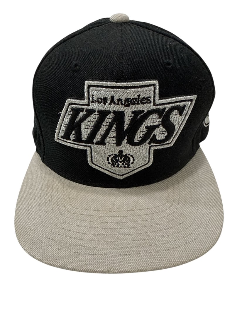 The Weeknd's Wardrobe - Mitchell & Ness snapback cap: Mitchell & Ness La Los Angeles Kings Cap Black Silver Snapback Adjustable Hat. CONDITION: Pre-owned. The photographs are part of this description - please review them carefully to assess condition. PR