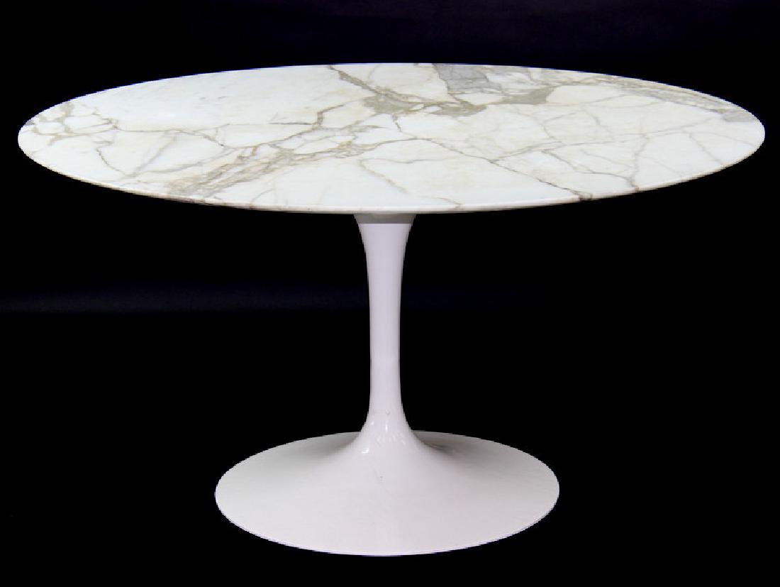 EERO SAARINEN FOR KNOLL INTERNATIONAL. 1970s: Eero Saarinen for knoll international 1970s. Marble dinning room table. Good condition. Painted base losses to marble. Unsigned. Measures 54" D 28" H. Third party shipping.