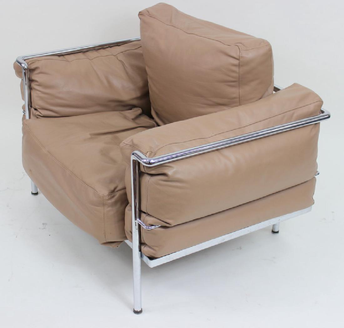 Style of Le Corbusier: chair, USA, 1980s; Enameled steel, leather; Unmarked; Shipping Third Party. Approximately 43"W with a seat height of approximately 15".