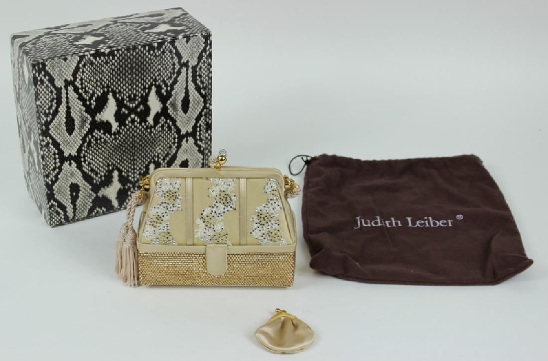 Judith Leiber Antique Quilt Hand Bag: This Judith Leiber Antique Quilt Hand Bag is in excellent condition. The color way beige and gold with rhinestones and has beige strap. There are no pockets on the inside. The approximate height is 5.