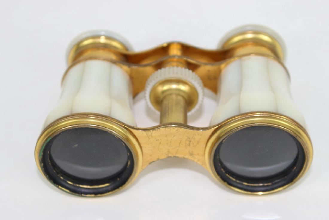 Mother of Pearl Opera Glasses: Mother of Pearl Opera Glasses. Stamped LEMAIRE PARIS. Wear consistent with age. Approximate Measurements: Height- 1 5/8 inches Width- 4 inches Depth-2 3/4 inches See Photos.
