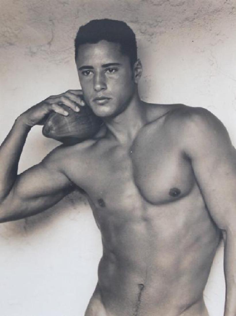BRUCE WEBER (AMERICAN, B. 1946) PHOTOGRAPHY: BRUCE WEBER (AMERICAN, B. 1946) PHOTOGRAPHY. Nude Male. Holding Football. Measures 12 inches high x 8 3/4 inches wide + 1 7/8 inch frame.