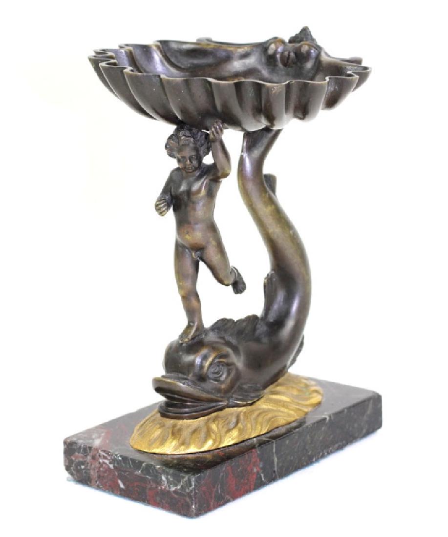 Antique French Bronze & Marble Figural Soap Dish: 19th century French Bronze soap dish of a nude putti figure standing atop a dolphin in fitted gilt mold, holding a large clam shell above his head, on a marble base. Original Patina. Measures approx.