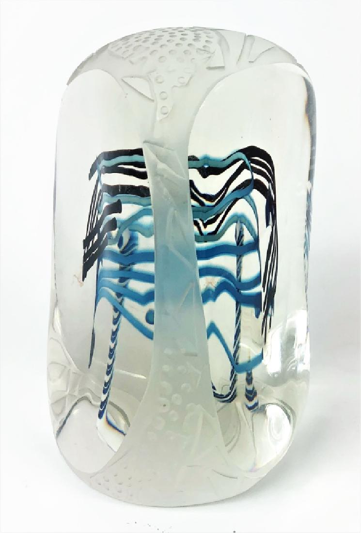 Contemporary Unsigned Art Glass Sculpture: Late 20th Century clear to etch molded art glass sculpture featuring visible blue/black swirl design to center. Measures 8-1/4" Tall x 5" Wide. From a Palm Beach estate. Local Pick Up or Third Party S
