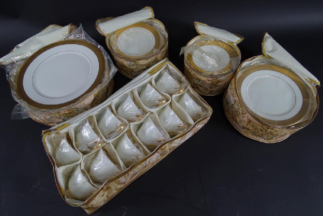 61 Piece Oxford "Maldon" Gold Trim Bone China Set: Service to include: (11) Dinner plates, (13) Bread plates, (12) Salad plates, (12) Teacups and (13) Saucers. From a Boca Raton estate. Local Pick Up or Third Party Shipping Required.