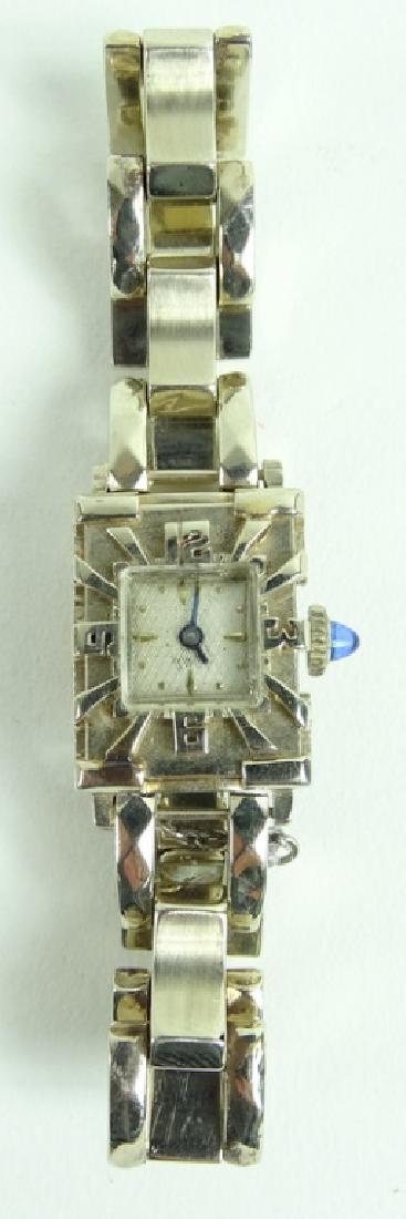 Art Deco 14K White Gold Sapphire Wrist Watch: Estate 14 karat white gold Art Deco chain link ladies wrist watch with sapphire cabochon crown. Marked 14KT to case & 14K to clasp. Fits a skinny 2" - 2 1/4" wrist. Total weight: 23.1 grams. From a Bo