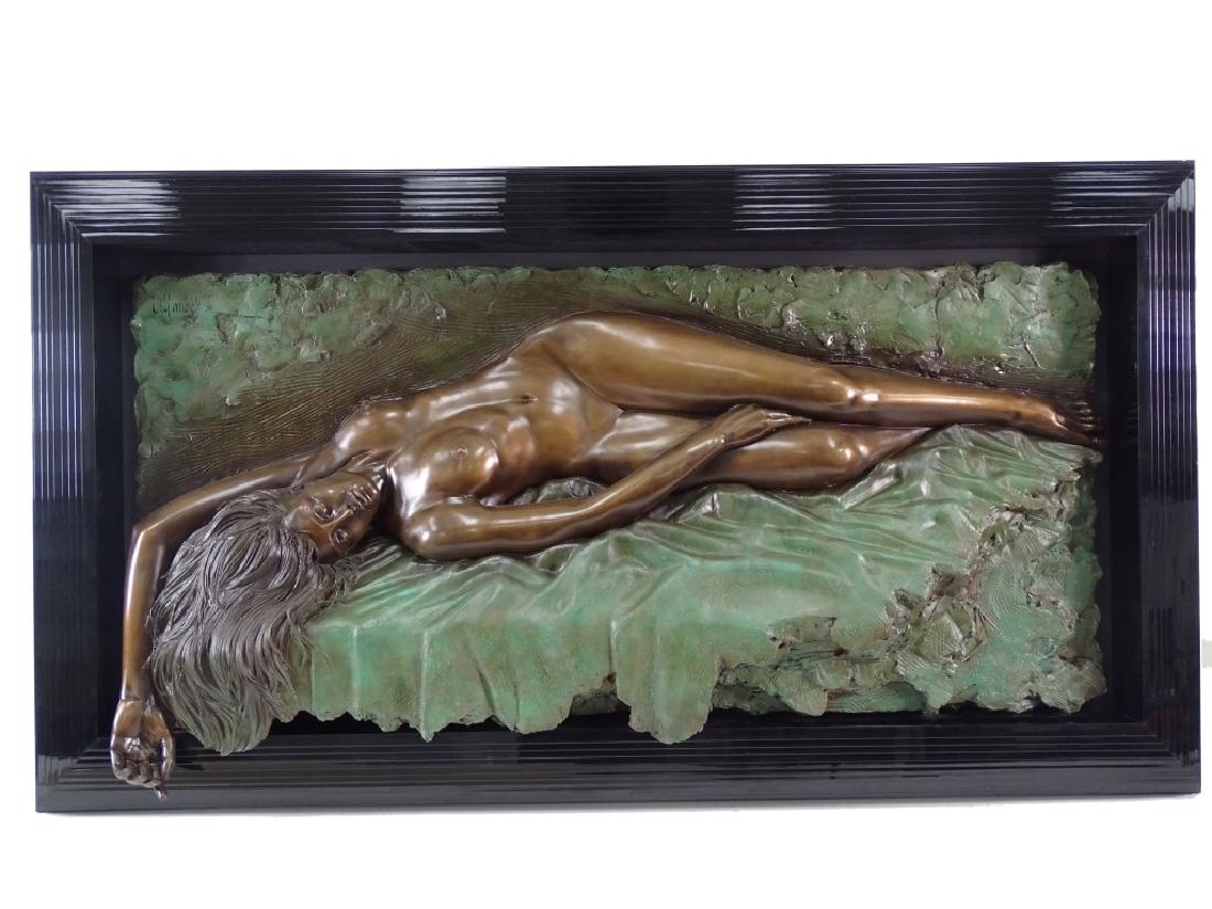 Bill Mack (American b. 1949) "HARMONY": A bonded bronze sculpture by Bill Mack titled:"Harmony". Features a nude woman laying on a bed of foliage with her hand hanging off the edge of the frame allowing for a realistic feel. Set in a concen