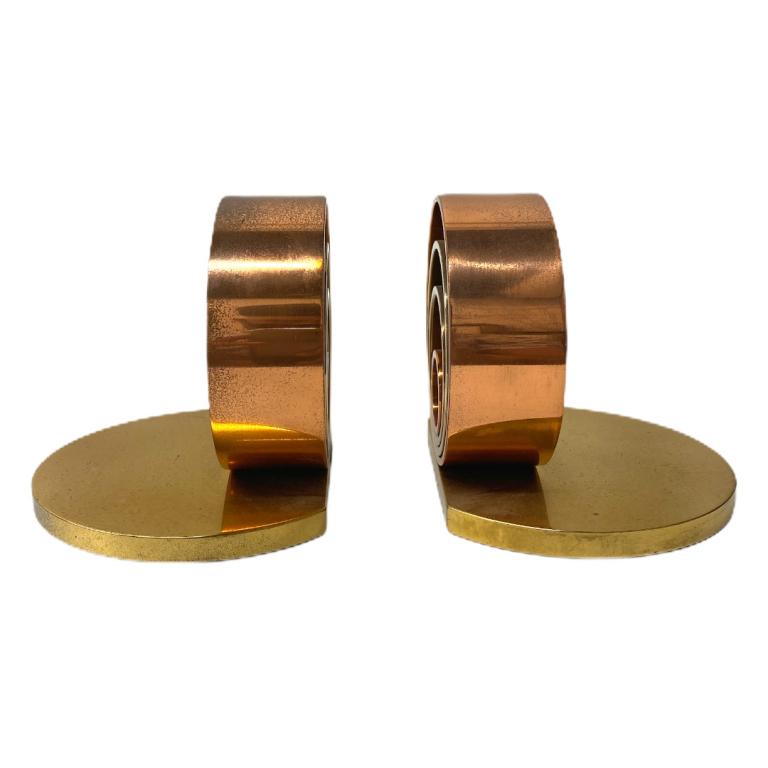 Modern Brass Book Ends: Modern Brass Book Ends. Measures 4 1/2 inches high x 5 inches wide.