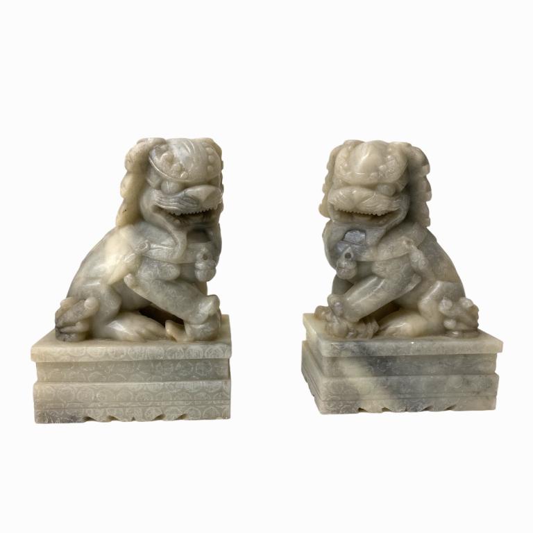 (2) 20th Century Chinese Hard Stone Foo Dogs: (2) 20th Century Chinese Hard Stone Foo Dogs. Measuring approximately 7 inches high x 3 inches wide x 4 inches wide.