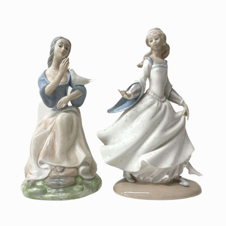 Pair of Lladro Figurines. Depicting a women holding a (1 of 4)