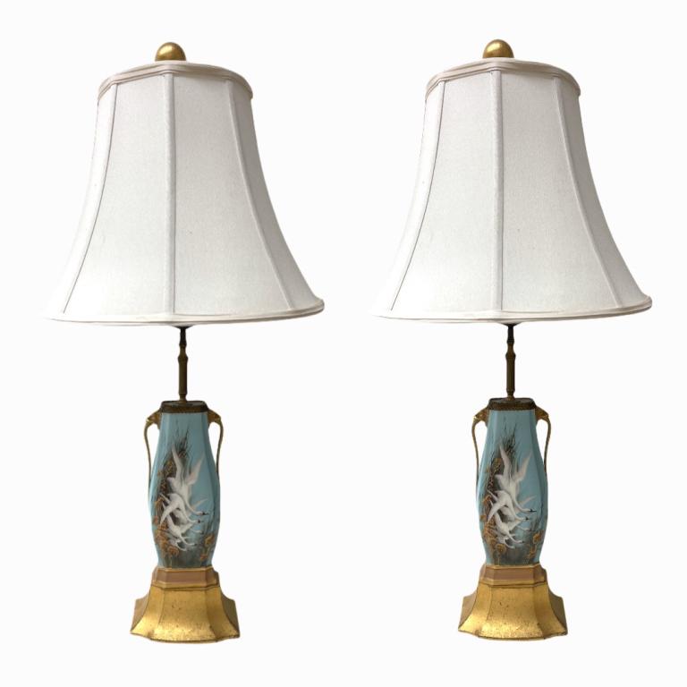 C. Baldwyn Pair of Hand Painted Flying Swans Lamps: C. Baldwyn Pair of Hand Painted Flying Swans Lamps. Incredibly decorated hand painted design by Charles Henry Clifford Baldwyn. Signed "C. Baldwyn". Brass handles depicting Coi Head. Measures 33 inche
