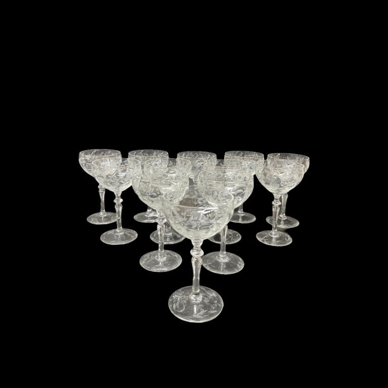 (12) Floral Etch Design Crystal Wine Glasses: (12) Floral Etch Design Crystal Wine Glasses. Measures 6 inches high x 3.5 inches deep.