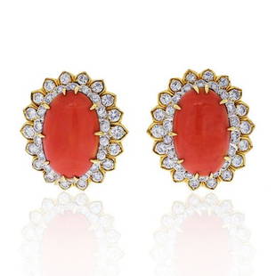 DAVID WEBB PLATINUM & 18K YELLOW GOLD OVAL CORAL: DAVID WEBB PLATINUM & 18K YELLOW GOLD OVAL CORAL AND ROUND CUT DIAMOND EARRINGS Coral isn't just a peachy color meant for the warmer months. In fact, the shade finds its roots in a deep red stone