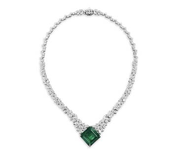 EMERALD AND DIAMOND NECKLACE: BEAUTIFUL EMERALD AND DIAMOND NECKLACE A tremendous Emerald and diamond necklace that inspires awe in any setting. With a center stone just shy of almost 37 carats but face up like 50 carats, this