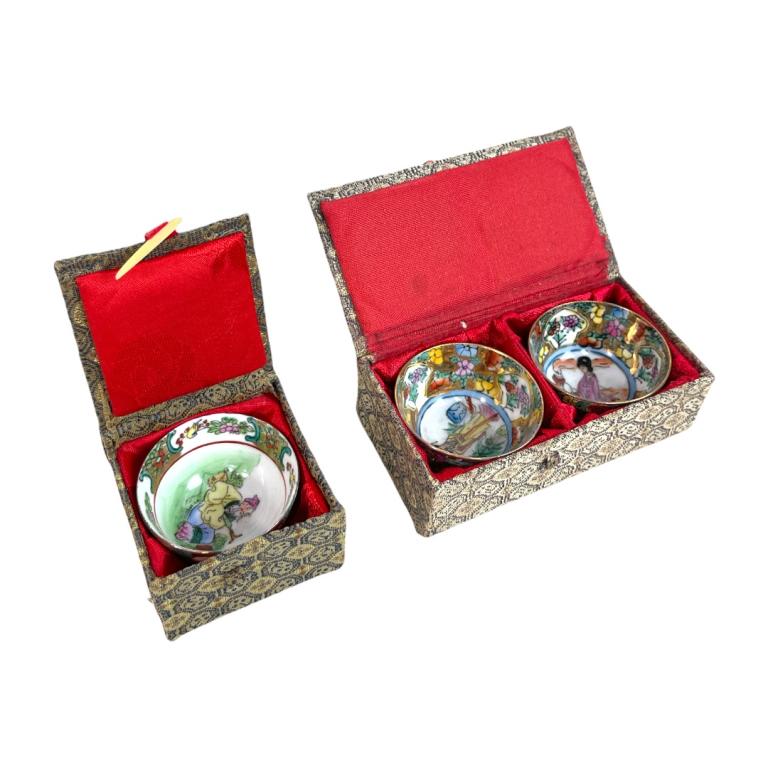 Set of 14 Chinese Hand Painted Miniature Wine Cups: A set of 14 vintage Chinese hand painted pocelain miniauture wine / tea cups with peony blooms designs with gold ground to exterior swith figures seen to interiors. Includes fitted presentation boxes.