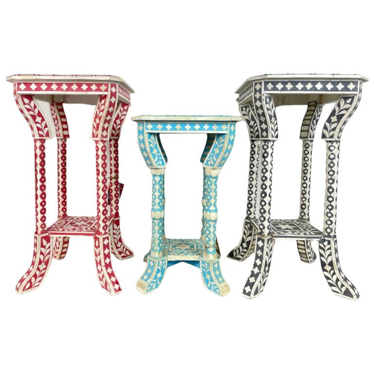 3 Indian Bone And Colored Wood Inlaid End Tables: A lot of 3 Indian end tables, one crafted of ebony, another with red stained wood with bone inlay and veneer design the third and smallest with light blue stained wood. Two largest measure approx. 24"