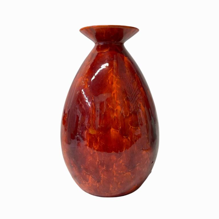Boch Freres Oxblood Red Glazed Porcelain Vase: A Boch Freres French porcelain vase having an oxblood red Sang de Beouf glazed finish with flared rim. Marked to bottom. Measures approx. 10 1/8" height x 7 1/4" diameter. Appears in overall good cond