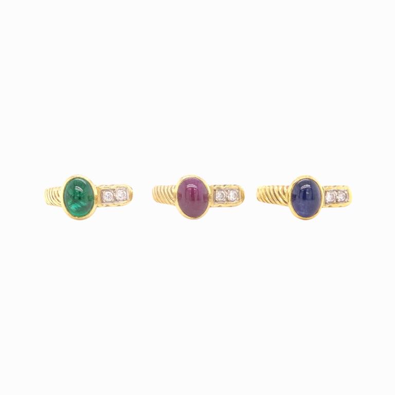 (3) Three Cassis 18K Gem Stackable Rings: (3) Three Cassis 18K Gem Stackable Rings. Ruby, Emerald And Sapphire And Diamond Rings.