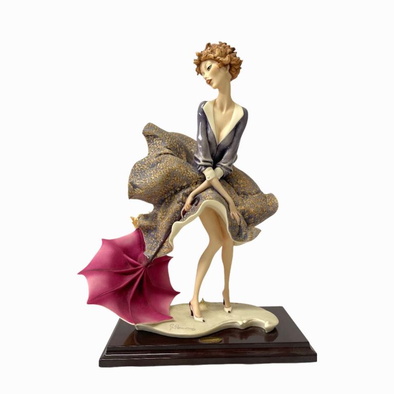 Giuseppe Armani "The Umbrella" Sculpture 0541C: Giuseppe Armani Italian porcelain sculpture titled "The Umbrella" number 0541C. Measures approx. 14 1/2" height. Includes original box. Appears in overall good condition.