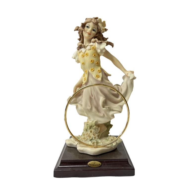 Giuseppe Armani "Freewheeling" 1142P: Giuseppe Armani Italian porcelain sculpture titled "Freewheeling" number 1142P. Measures approx. 8 3/4" height. Includes original box. Appears in overall good condition.