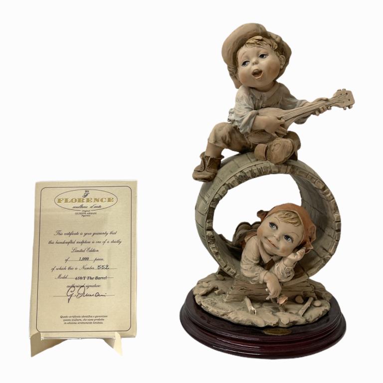 Giuseppe Armani "The Barrel" Sculpture 0659T: Giuseppe Armani Italian porcelain sculpture titled "The Barrel" number 0659T. Measures approx. 12" height. Includes original box. Appears in overall good condition.