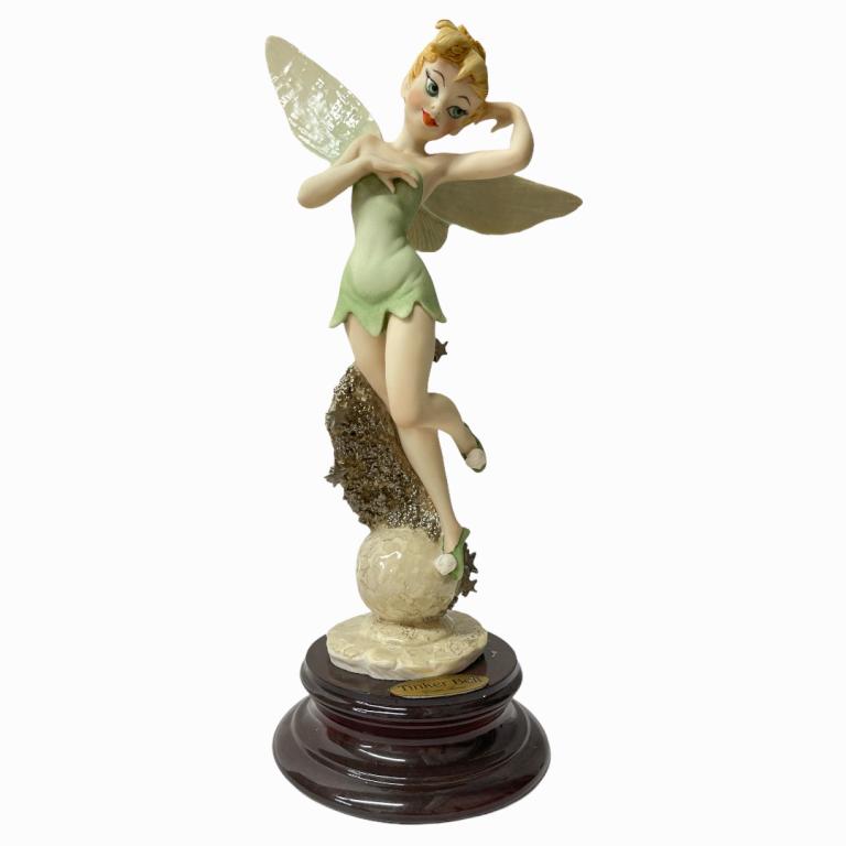 Giuseppe Armani "Tinker Bell" Sculpture 0108C: Giuseppe Armani Italian porcelain Walt Disney sculpture titled "Tinker Bell" number 0108C. Measures approx. 12 3/4" height. Includes original box. Appears in overall good condition.