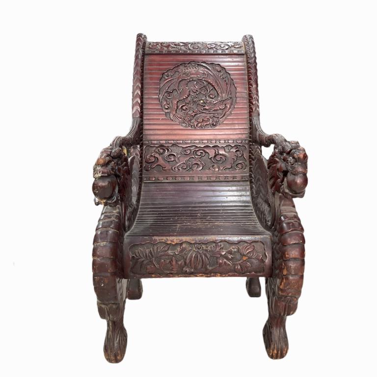 Antique Chinese Carved Wooden Dragons Arm Chair: Very vintage, possibly antique, large Chinese hand carved wooden arm chair having figural dragon sides and arms. Center medallion to back having relief carved dragons with bone inlaid eye. Measures ap