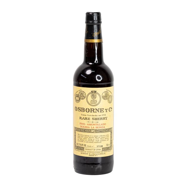 Vintage Osborne y Ca Spanish Rare Sherry 750mL: Vintage Osborne & Company Spain rare sherry wine in 750mL bottle. Sealed and kept in cellar. Serial number 37186. Some minor wear to label.