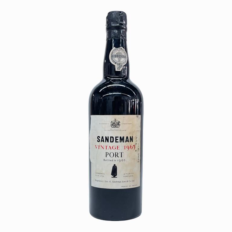 1963 Sandeman Portuguese Vintage Port Wine: 1963 George G. Sandeman & Company Vintage Portuguese Port Wine. Approx. 700 to 750mL? Sealed and kept in cellar. Some wear to labels and loss to paper seal.