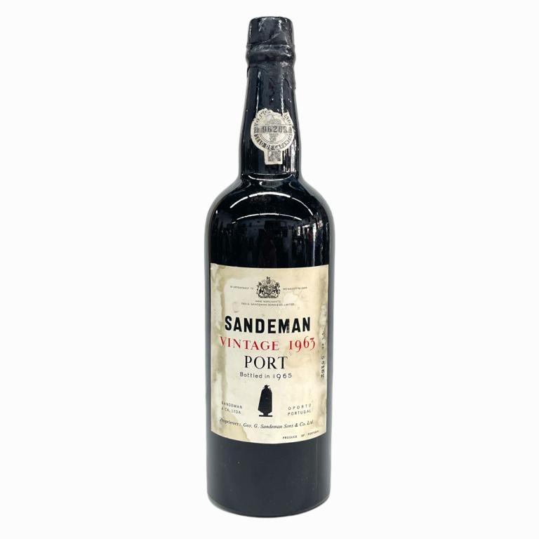 1963 Sandeman Portuguese Vintage Port Wine: 1963 George G. Sandeman & Company Vintage Portuguese Port Wine. Approx. 700 to 750mL? Sealed and kept in cellar. Some wear to labels and loss to paper seal.