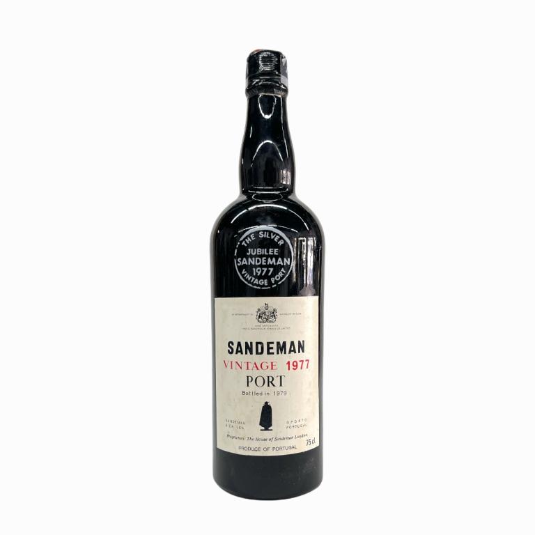 1977 Sandeman Portuguese Vintage Port Wine: 1977 George G. Sandeman & Company Vintage Portuguese Port Wine. Approx. 700 to 750mL? Sealed and kept in cellar. Some wear to labels and paper seal completely gone.