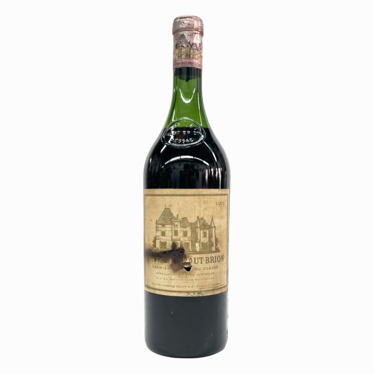 1959 Chateau Haut-Brion Grand Cru 750mL Wine: 1959 French Chateau Haut-Brion Grand Cru wine in 750mL bottle. Sealed and kept in storage. High shoulder fill. Some wear to labels and seal cover. Has Sotheby's label to side.