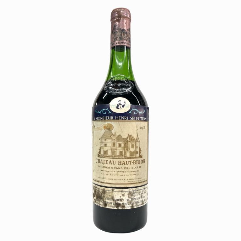 1966 Chateau Haut-Brion Grand Cru 750mL Wine: 1966 French Chateau Haut-Brion Grand Cru wine in 750mL bottle. Sealed and kept in storage. Mid shoulder fill. Some wear to labels and seal cover. Has Sotheby's label to side.