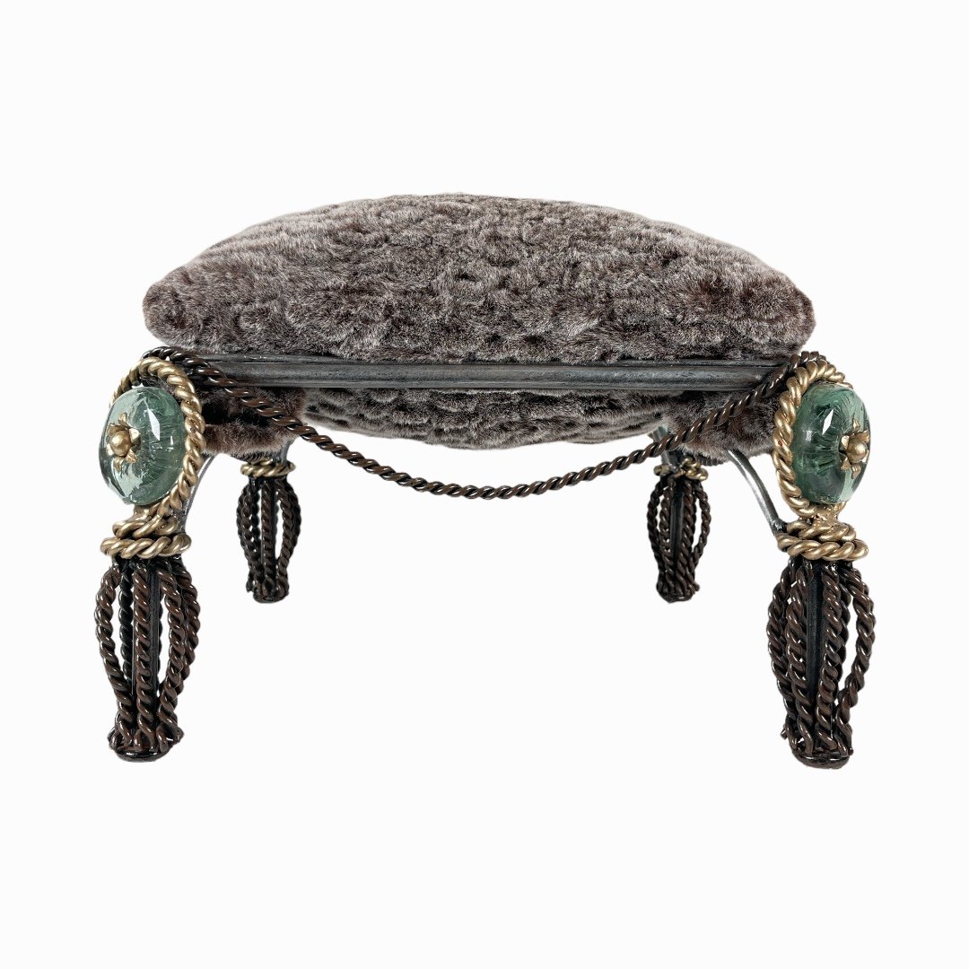 Mid Century Hollywood Regency Gil Bronze Ottoman: A vintage mid-century Hollywood Regency ottoman crafted of twisted wire gilt bronze frame with glass accent and attached pillow. Measures approx. 11 1/2" height x 16 1/2" width x 16 1/2" depth. Appear