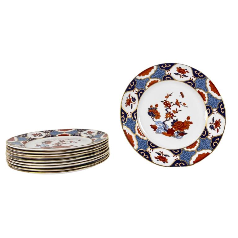 10 Spode English Bone China "Shima" Dinner Plates: A lot of ten Spode English Bone China porcelain dinner plates in the "Shima" pattern having a Japanese Imari Japonisme design with flowers emerging from rock formation to center completed with gold gi