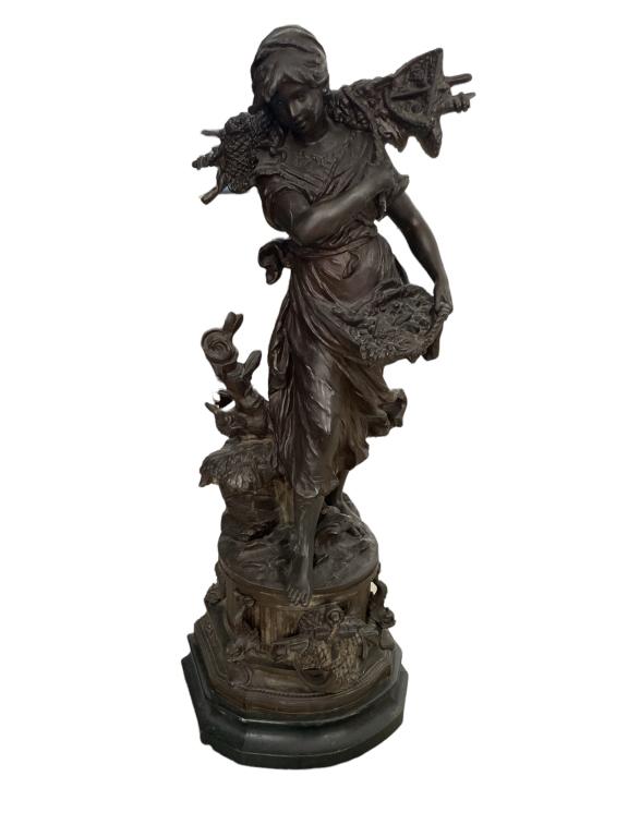After Moreau, a French metal spelter with bronze finish large sculpture depicting a woman holding a (1 of 4)