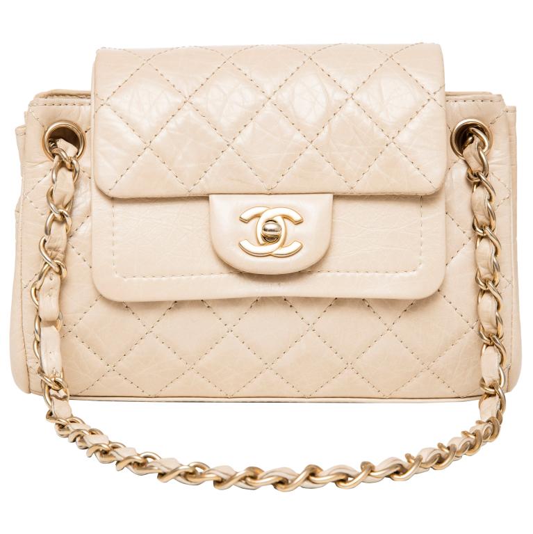 Designer Chanel Paris Sac Class Rabat Uni beige leather purse. Has gold tone hardware. Includes (1 of 3)