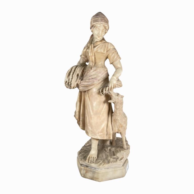 A heavy solid carved Italian alabaster stone carving depicting a woman with sheep. No apparent (1 of 4)