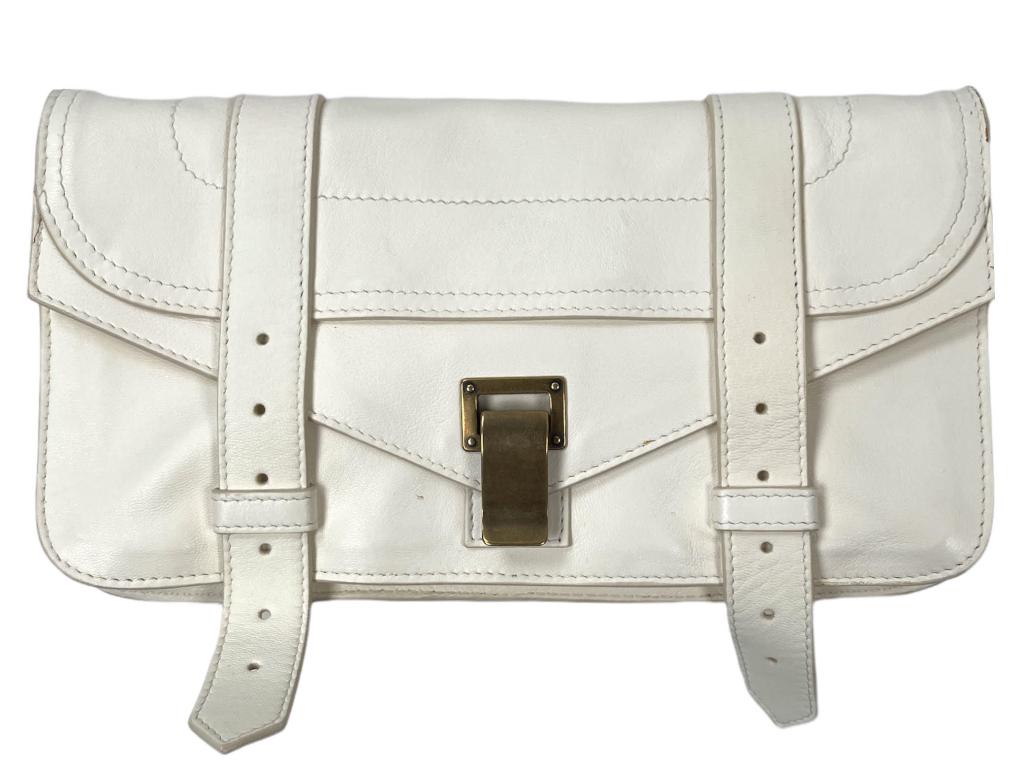 PS1 Pochette from Proenza Schouler is crafted in genuine white leather featuring tonal stitching: PS1 Pochette from Proenza Schouler is crafted in genuine white leather featuring tonal stitching throughout, an exterior zip pocket, a fold over front flap with gold-tone hardware. The interior is in