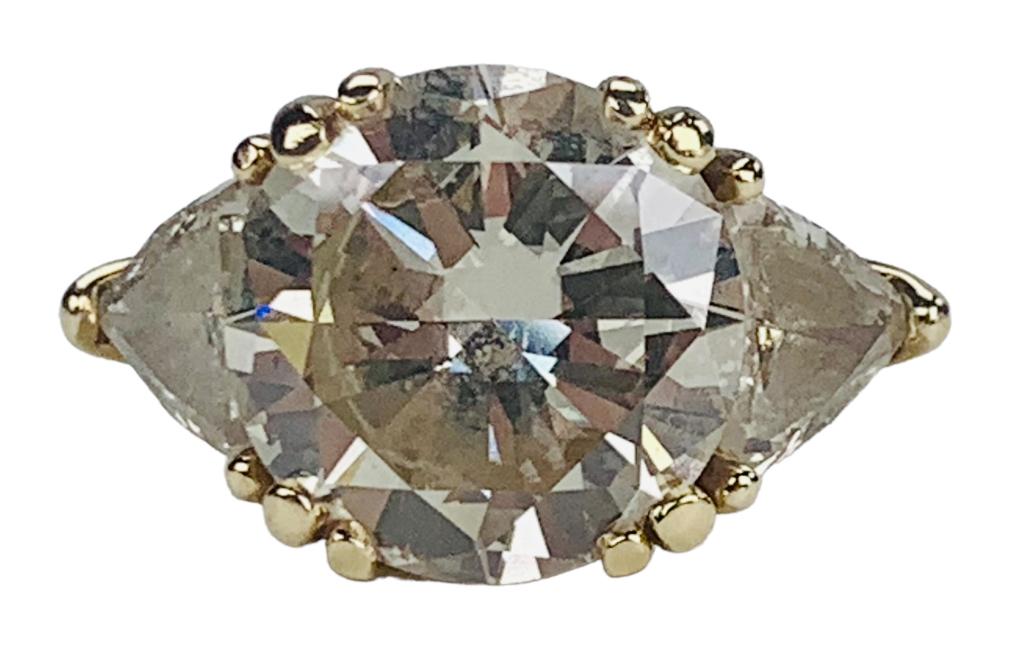 Large diamond engagement ring. Center stone approx 7.80ct. Off color, yellow. (1 of 2)