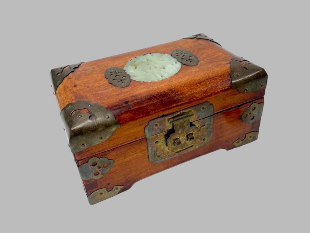 Rare Vintage Shanghai Rosewood With Brass Accents: Vintage Shanghai Rosewood with Brass Accent and Carved Stone Centerpiece Jewelry Box. This piece is on a good condition for its age. Diameters: H: 3 1/2 inches W: 6 1/2 inches D: 4 inches DL-#13/CB-B
